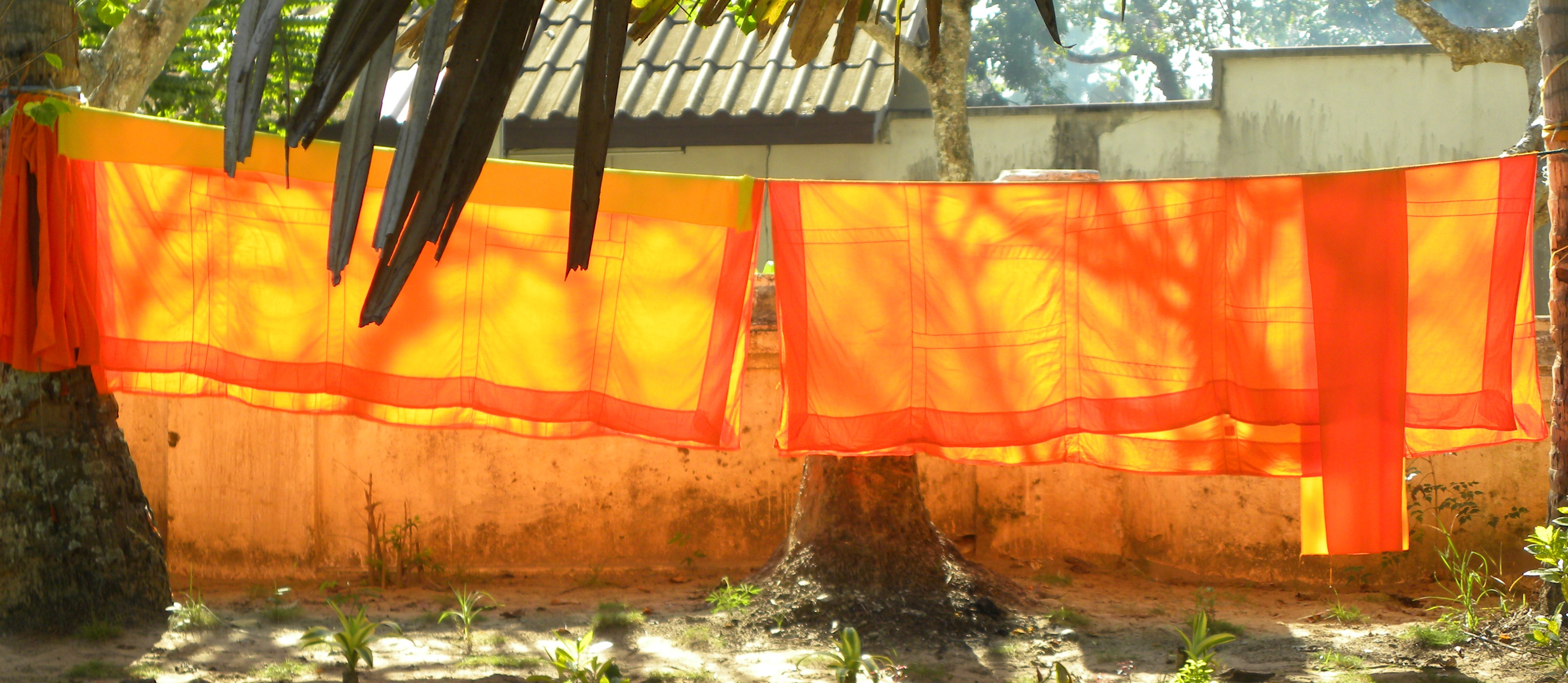 Bright orange fabric hanging outdoors
